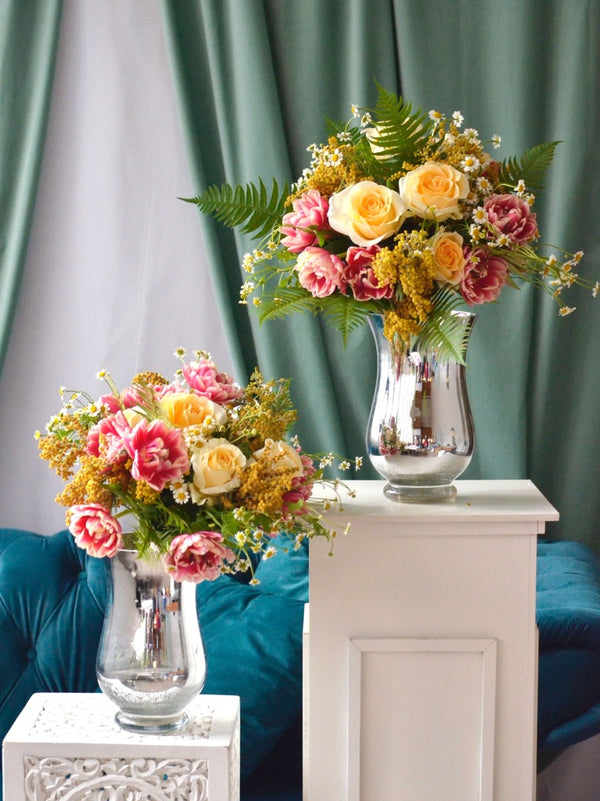 Beginner floristry course, hand tied bouquet with roses, tulips, matricaria and acacia