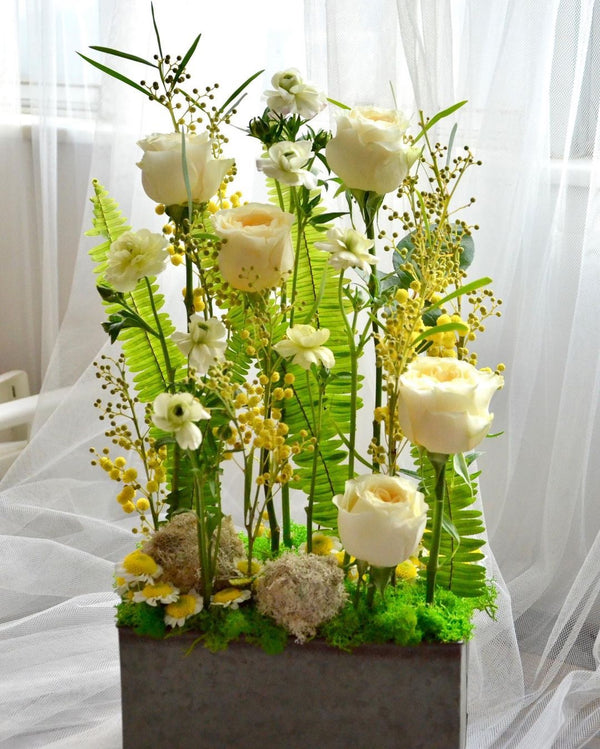 Beginner floristry course, parallel design with roses, butterfly ranunculus, acacia and spray chrysanthemums