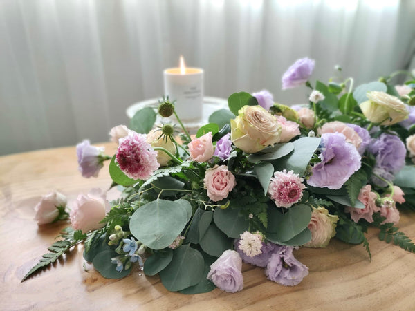 Intermediate floristry course, low table centrepiece with roses, lisianthus, scabiosa, didiscus and oxypetalum