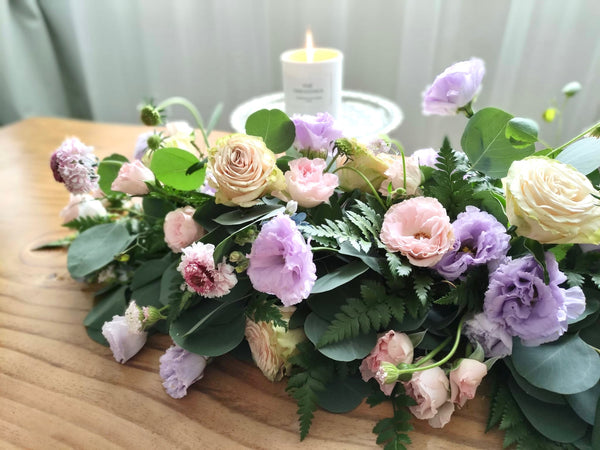 Intermediate floristry course, low table centrepiece with roses, lisianthus, scabiosa, didiscus and oxypetalum