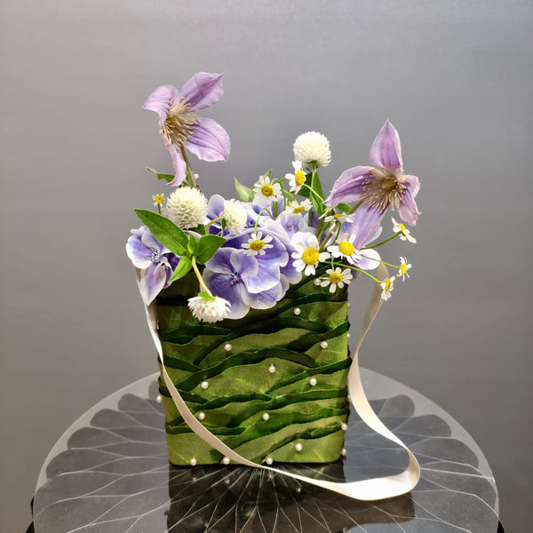 Intermediate floristry course, floral handbag with hydrangeas, matricaria, clematis and gomphrena, featuring leafing technique