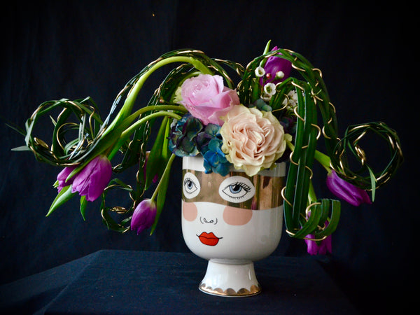 Intermediate floristry course, flower arrangement with hydrangeas, roses and tulips, featuring leaf manipulation technique