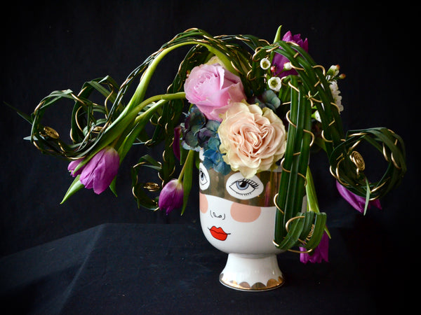 Intermediate floristry course, flower arrangement with hydrangeas, roses and tulips, featuring leaf manipulation technique