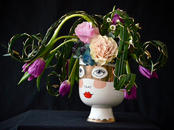 Intermediate floristry course, flower arrangement with hydrangeas, roses and tulips, featuring leaf manipulation technique