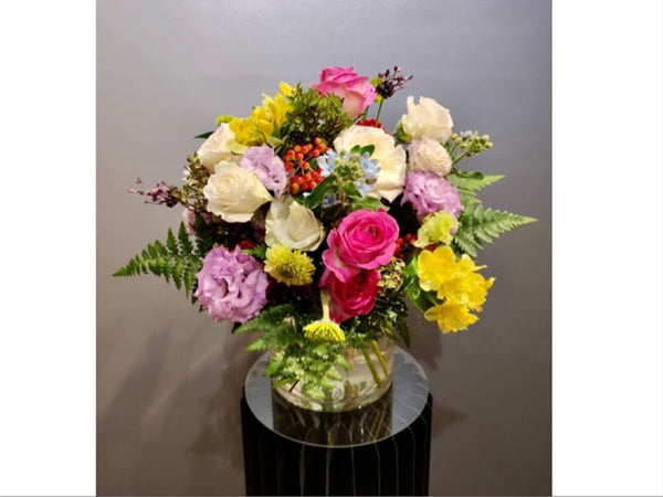 Intermediate floristry course, hand tied bouquet with roses, lisianthus, alstroemeria, viburnum berries, oxypetalum and asters