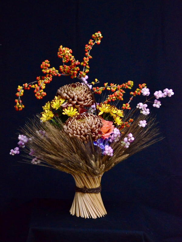 Intermediate floristry course, vase arrangement with dried wheat, celastrus, hydrangeas, roses, chrysanthemums and symphoricarpos