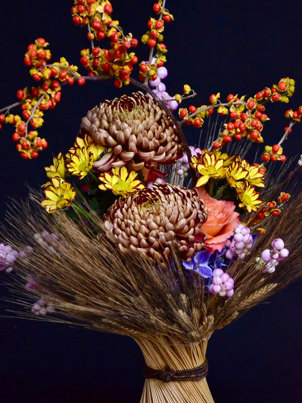 Intermediate floristry course, vase arrangement with dried wheat, celastrus, hydrangeas, roses, chrysanthemums and symphoricarpos