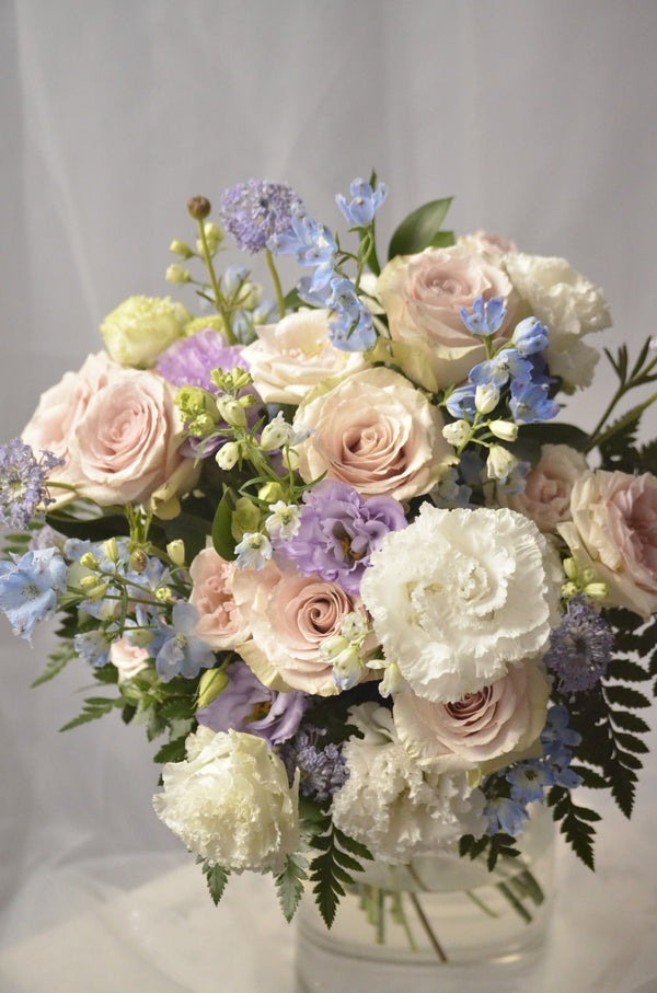 one day taster floristry workshop, hand tied bouquet in pastel colours, with roses, lisianthus, delphiniums and didiscus