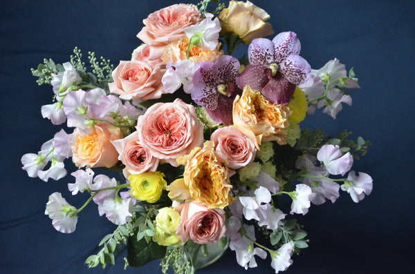 one day taster floristry workshop, hand tied bouquet with garden roses, ranunculus, lathyrus, acacia and vanda