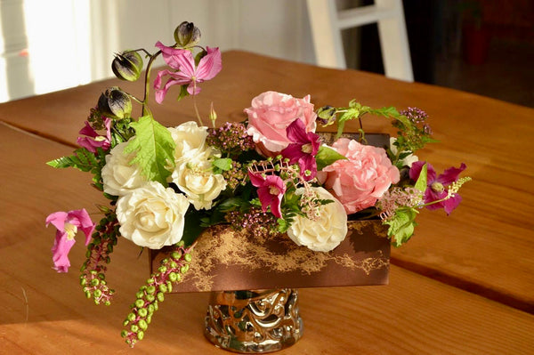 Beginner floristry course, flower box design with roses, clematis and phytolacca
