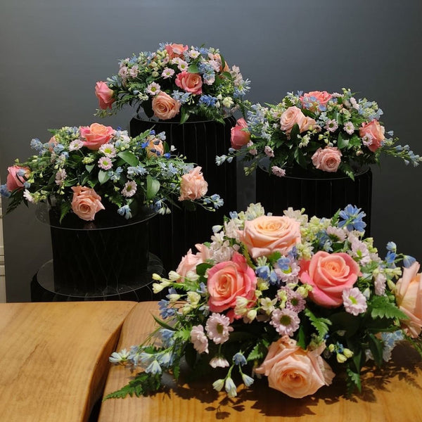 Beginner floristry course, horizontal design with roses, delphiniums and spray chrysanthemums