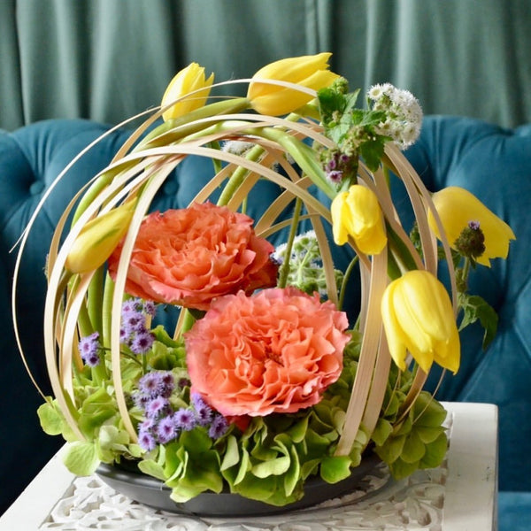 Floristry class. Student's work. Round arrangement highlighting positive vs. negative space, and line.