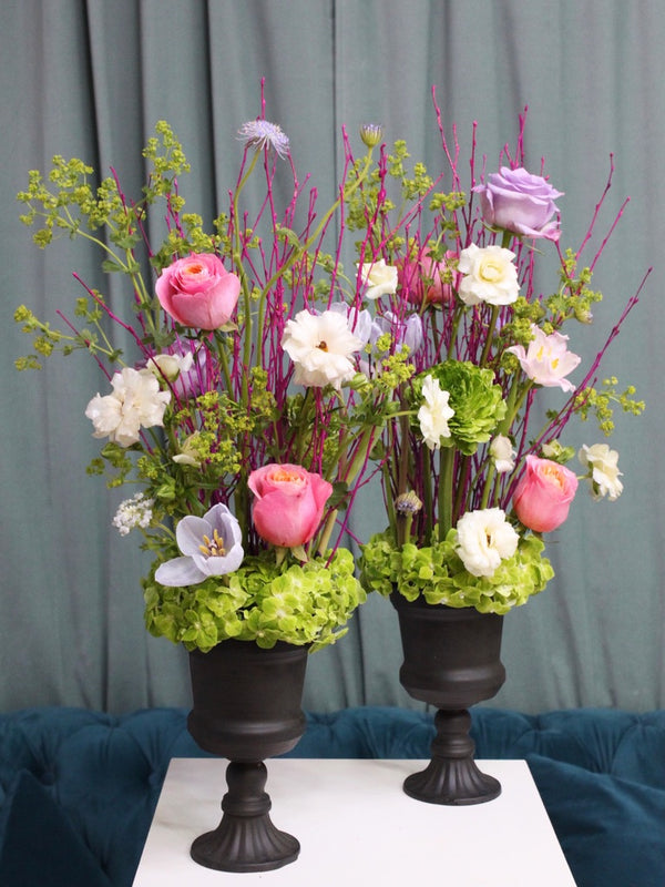 Beginner floristry course, vertical design with birch twigs, hydrangeas, roses, tulips, ranunculus, didiscus and alchemilla