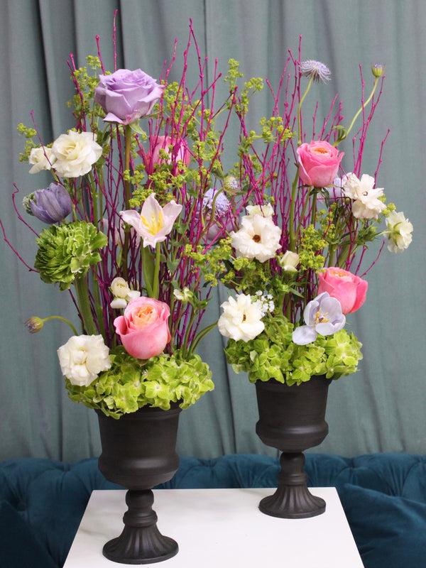 Beginner floristry course, vertical design with birch twigs, hydrangeas, roses, tulips, ranunculus, didiscus and alchemilla