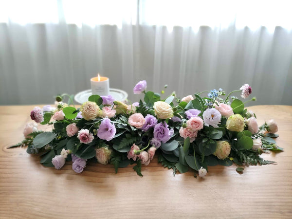 Intermediate floristry course, low table centrepiece with roses, lisianthus, scabiosa, didiscus and oxypetalum