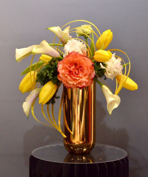 Intermediate floristry course, crescent shape flower arrangement with roses, tulips, lisianthus and calla lilies