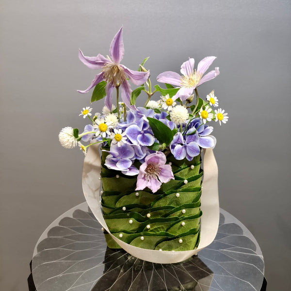 Intermediate floristry course, floral handbag with hydrangeas, matricaria, clematis and gomphrena, featuring leafing technique