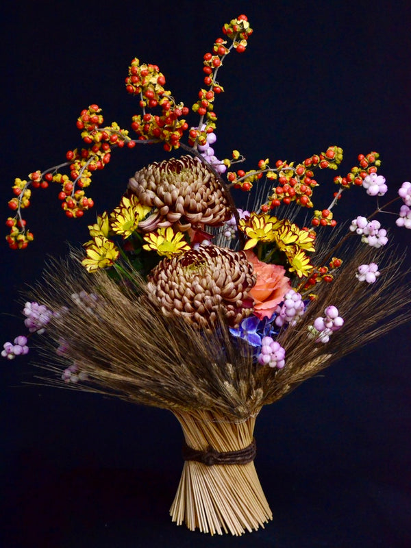 Intermediate floristry course, vase arrangement with dried wheat, celastrus, hydrangeas, roses, chrysanthemums and symphoricarpos