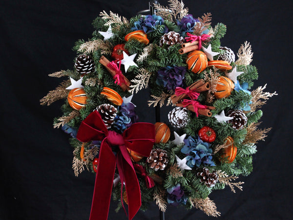 seasonal wreath workshop, christmas wreaths made by student, vibrant colour combination