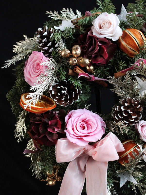 seasonal wreath workshop, christmas wreath made by student, vibrant colour combination